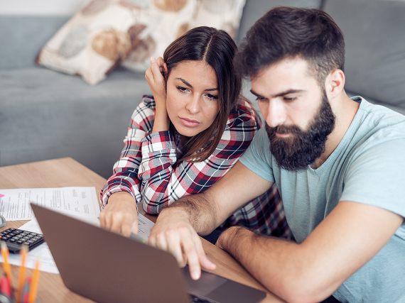 two people looking at computer